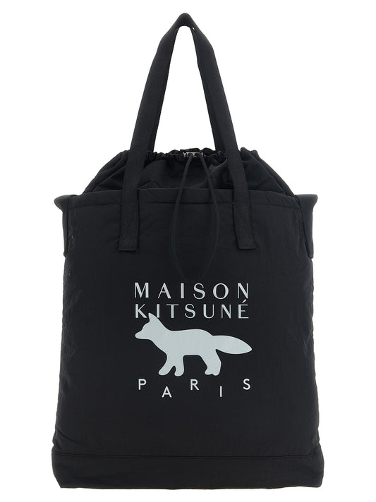 This Large Tote Bag by Maison Kitsuné for men in nylon black, herringbone & print features an on trend Ribbon Nylon Large Tote Bag design with a secure drawstring, ample , and on trend shoulder-strap, adjustable-strap & handle.