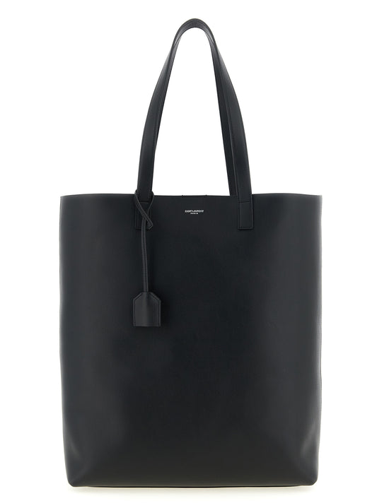 This Shopper Tote Bag by Saint Laurent for men in calfskin leather black & print features an on trend Calfskin Leather Shopper Tote Bag design with a secure , ample , and on trend handle.
