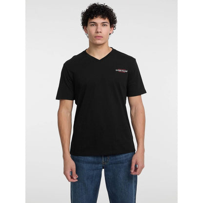 T-Shirt by Guess Jeans for men in cotton black showcases a fashionable silhouette, elegantly detailed with a fashionable and for a sophisticated, high-fashion look.