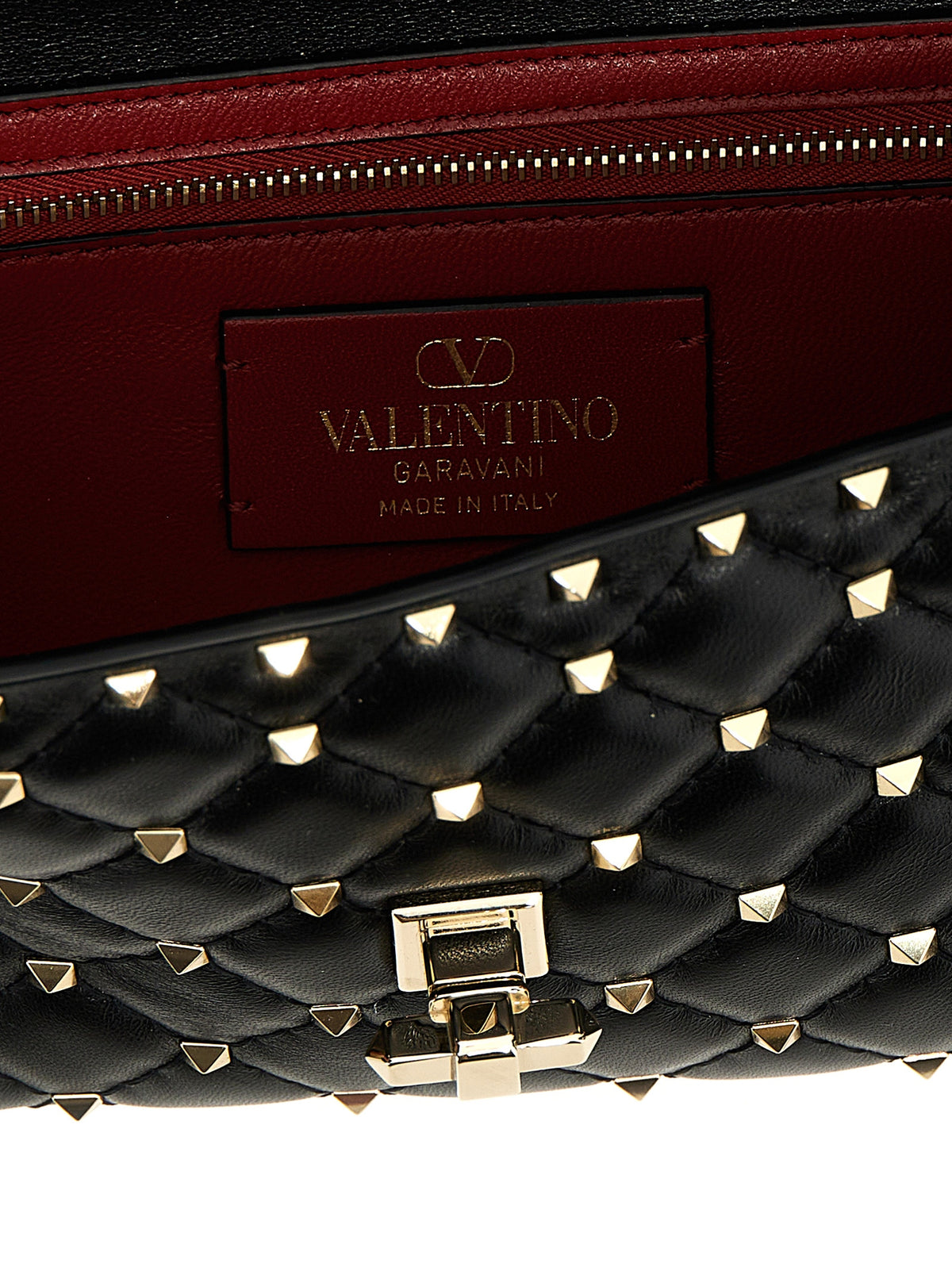 Quilted Shoulder Bag by Valentino Garavani for women in nappa lamb leather black features an effortlessly chic silhouette with a secure , ample , and versatile shoulder-strap for effortlessly chic everyday luxury.