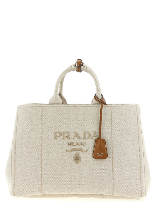 Large Shopper Tote Bag by Prada for men in linen cotton & leather beige showcases a urban-chic Linen Cotton & Leather Large Shopper Tote Bag design, featuring a secure , ample , and versatile shoulder-strap, adjustable-strap & handle for a urban-chic finish.