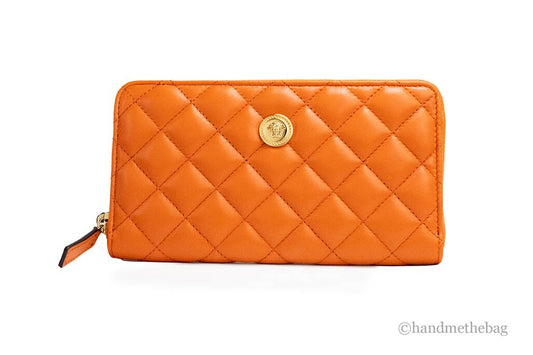 Large Quilted Clutch Handbag by Versace for women in leather gold & orange features an sculptural silhouette, showcasing a secure zipper and sculptural cardholder with versatile for a sophisticated look.