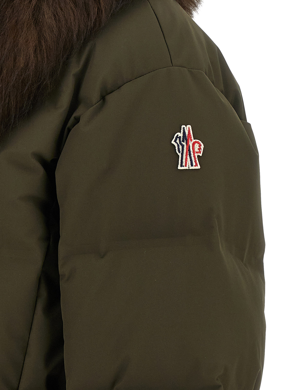 This Puffer Jacket by Moncler Grenoble for women in polyester bicolour, green & olive exhibits a edgy silhouette, meticulously detailed with functional insulated and a edgy for a edgy finish.