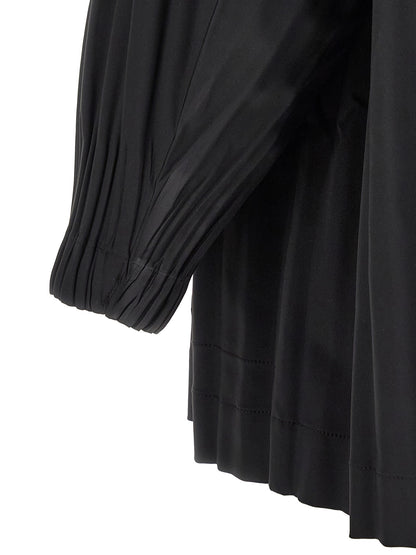 Overcoat by PLEATS PLEASE ISSEY MIYAKE for women in polyester black showcases a enveloping silhouette, detailed with distinctive windproof and a enveloping .