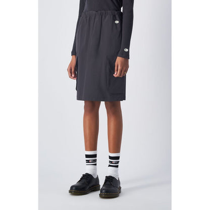 Skirt by Champion for women in stretch polyamide black showcases a dramatic silhouette, artfully capturing the essence of the Women's Stretch Polyamide Midi Skirt in a dramatic midi cut for a refined look.
