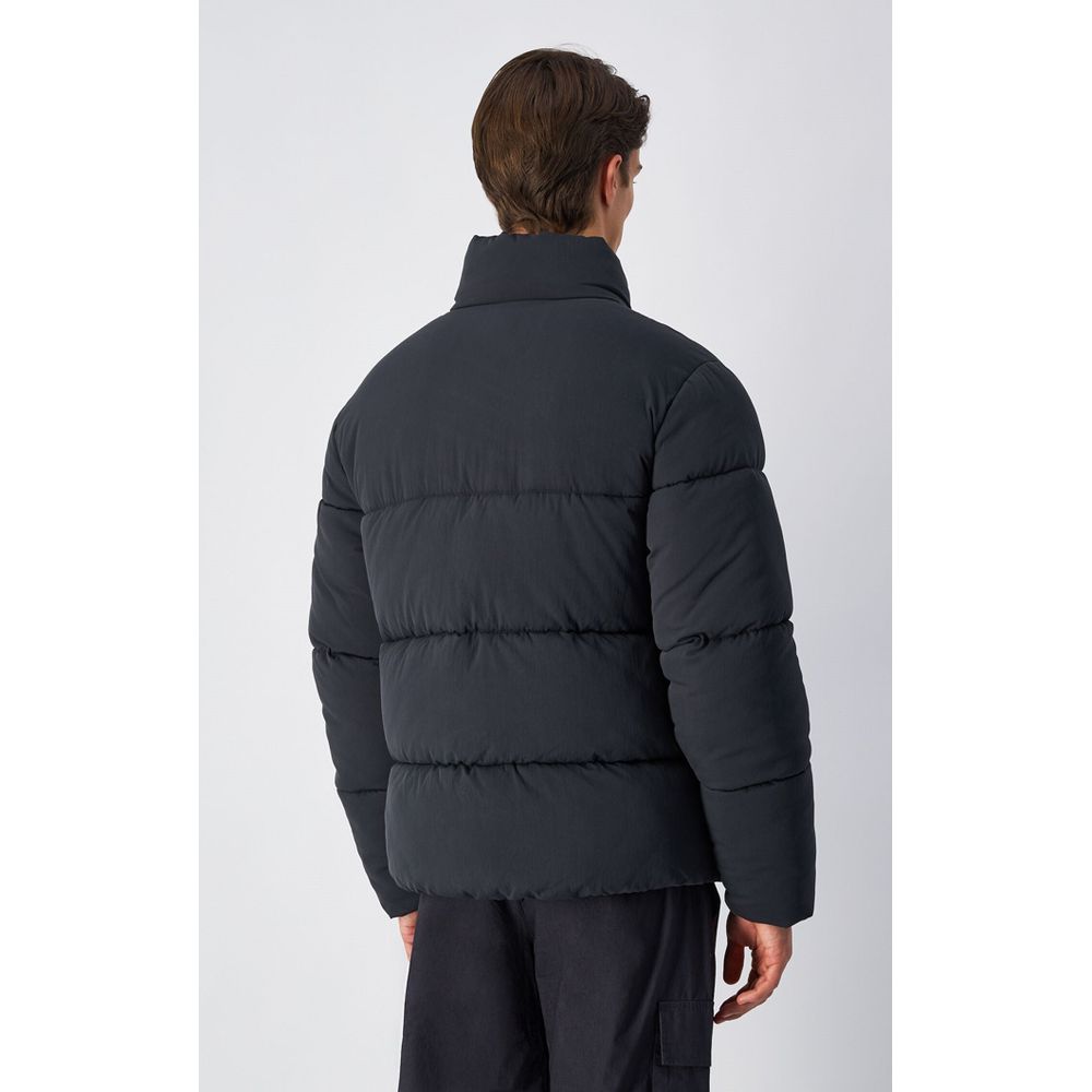 Parka by Champion for men in polyamide black presents a decadent silhouette, showcasing the decadent and functional insulated for a premium, weather-ready look.