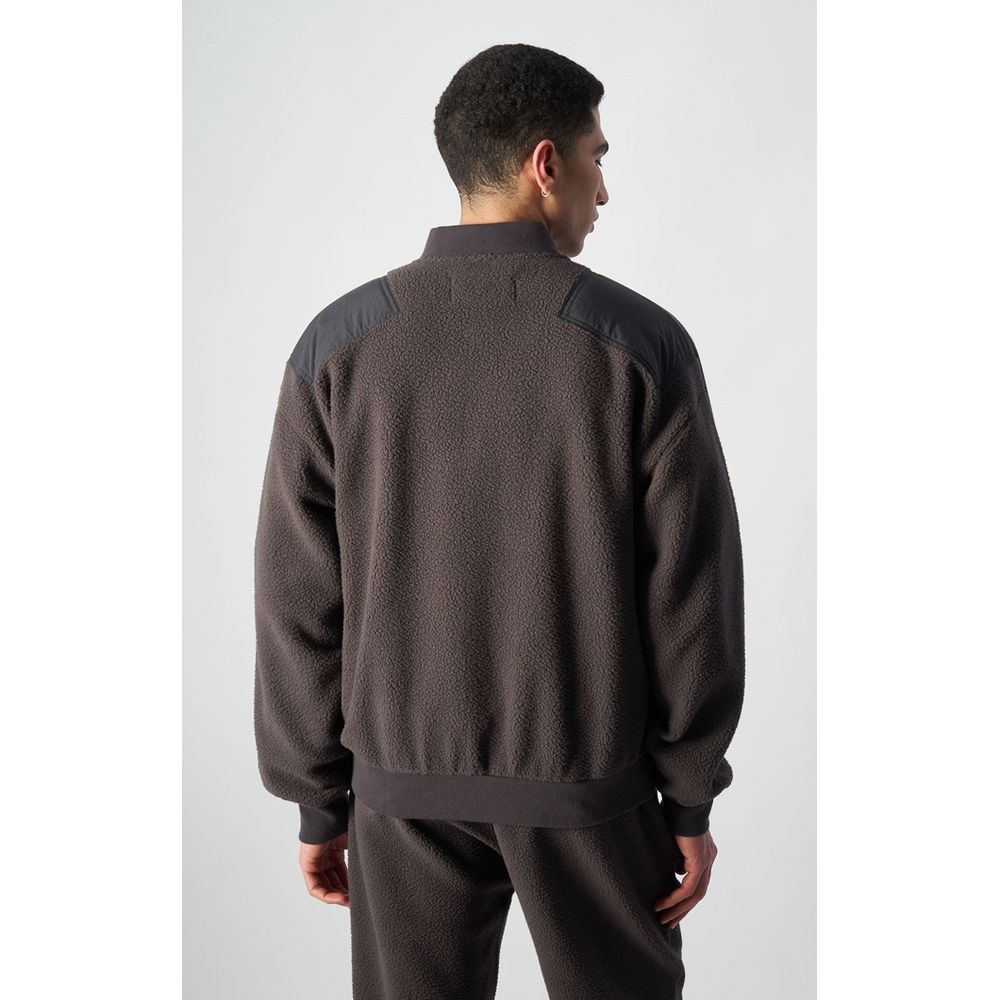 This Bomber Jacket by Champion for men in polyester black exhibits a edgy silhouette, meticulously detailed with functional and a edgy for a edgy finish.
