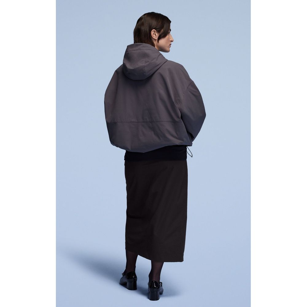 Skirt by Champion for women in polyester blue showcases a dramatic silhouette, artfully capturing the essence of the Women's Polyester Long Skirt in a dramatic long cut for a refined look.