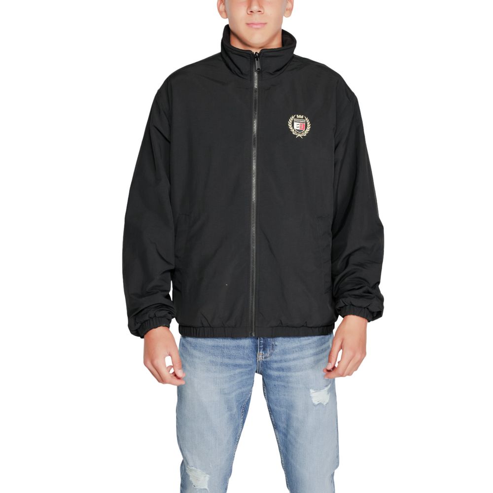 Trench Coat by Tommy Hilfiger Jeans for men in polyester black presents an sculptural silhouette, artfully detailed with a sculptural high-collar neckline and functional for a truly sculptural finish.