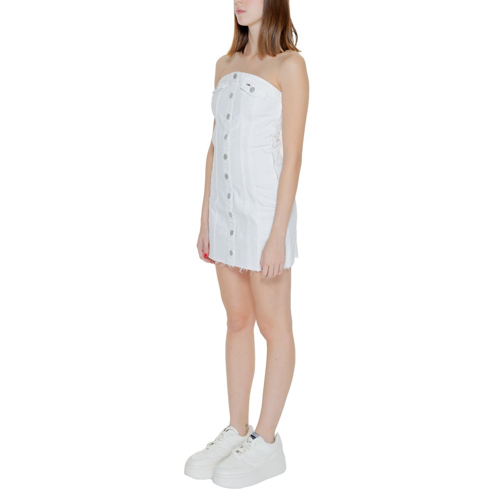 Dress by Tommy Hilfiger Jeans for women in stretch cotton white features an cute silhouette, detailed with a and that elegantly flows into a cute short.