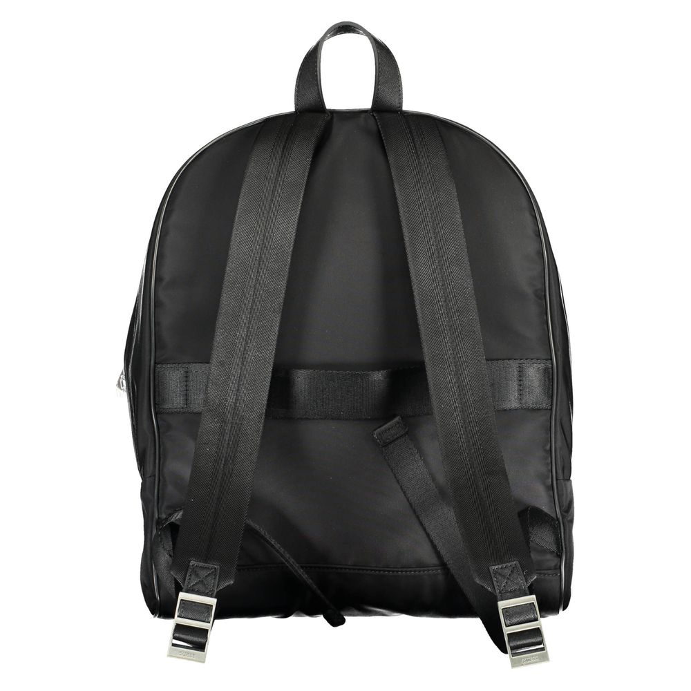Backpack by Guess Jeans for men in nylon black presents a stately Nylon Backpack design, showcasing a secure zipper with ample external-pockets, internal-pockets & laptop-compartment and versatile handle, backpack-strap & adjustable-strap for a stately finish.