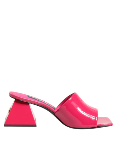 Mules Sandals by Dolce & Gabbana for women in calf leather and gold & pink presents a captivating silhouette, showcasing the signature style of the Women's Calf Leather Mules Sandals with a captivating block-heel and captivating open toe style.
