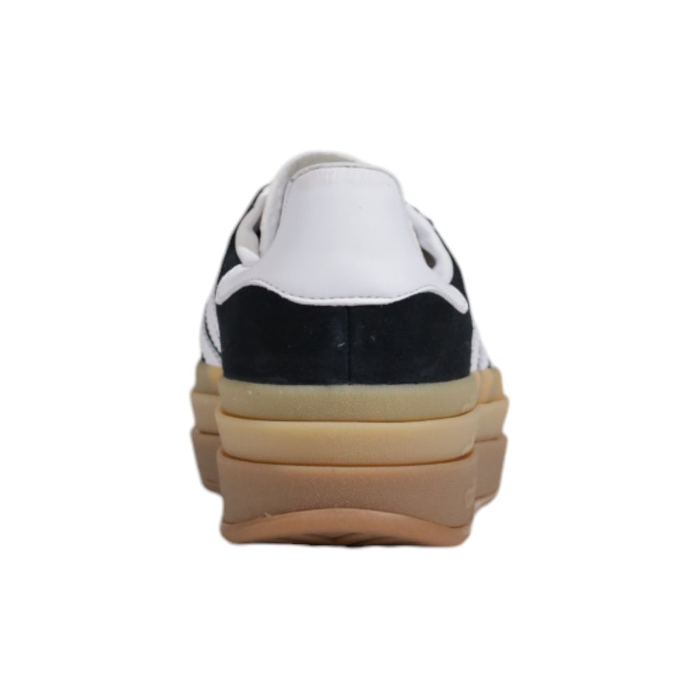 Sneakers by Adidas Originals for women in suede leather & rubber black & striped presents a sumptuous silhouette, artfully capturing the essence of the Women's Casual Suede Leather & Rubber Sneakers with its sumptuous casual style design.