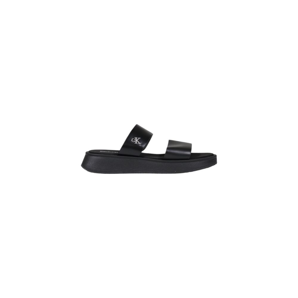Slider Sandals by Calvin Klein Jeans for women in leather and black presents a sculptural silhouette, showcasing the signature style of the Women's Leather Slider Sandals with a sculptural and sculptural .