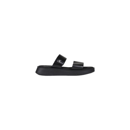 Slider Sandals by Calvin Klein Jeans for women in leather and black presents a sculptural silhouette, showcasing the signature style of the Women's Leather Slider Sandals with a sculptural and sculptural .