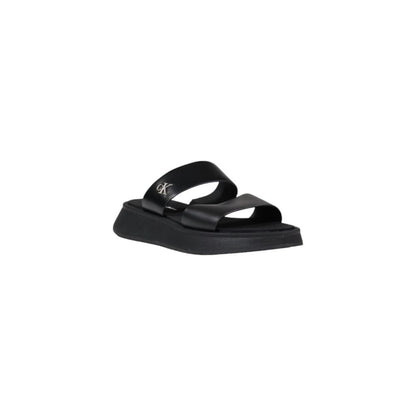 Slider Sandals by Calvin Klein Jeans for women in leather black features an architectural design from the Women's Leather Slider Sandals collection, defined by a architectural and for a architectural finish.