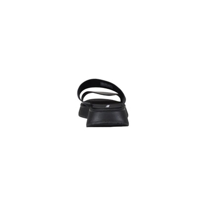 Slider Sandals by Calvin Klein Jeans for women in leather black showcases a sculptural silhouette as Women's Leather Slider Sandals, defined by a sculptural and sculptural for a sculptural look.