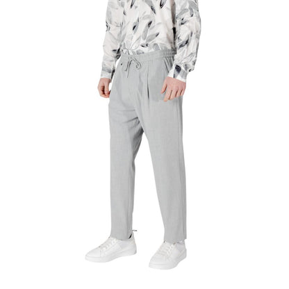 Trousers by Antony Morato for men in stretch polyester & viscose gray presents a smart silhouette, meticulously detailed with a smart regular-fit, a smart long, and a smart .