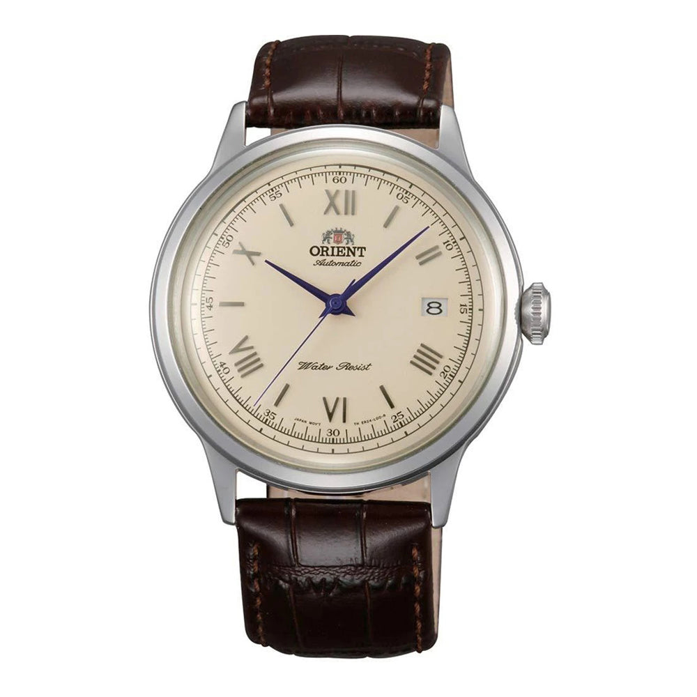 An Orient Bambino Automatic watch with a silver case, gold dial, and brown leather strap.