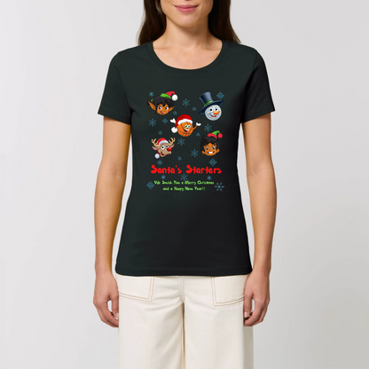Model wearing a christmas t-shirt with a print design on front, The design has 5 cartoon character heads of 2 elves, a snowman, rundolf and a Basketball face with the heading Santa's starters and sub heading og We swish you a merry Christmas and a hoopy New Year. The t-shirt is Black