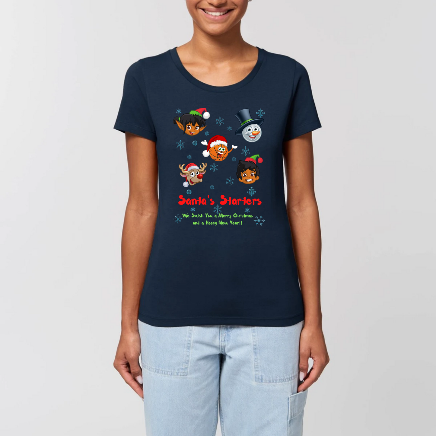 Model wearing a christmas t-shirt with a print design on front, The design has 5 cartoon character heads of 2 elves, a snowman, rundolf and a Basketball face with the heading Santa's starters and sub heading og We swish you a merry Christmas and a hoopy New Year. The t-shirt is Navy