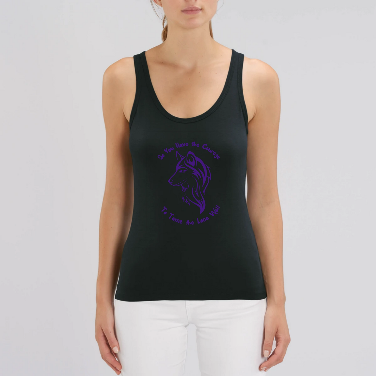 Model wearing a tank top with graphic design of a lone female wolf with wording Do you have the courage to tame the lone wolf. The tank top is black