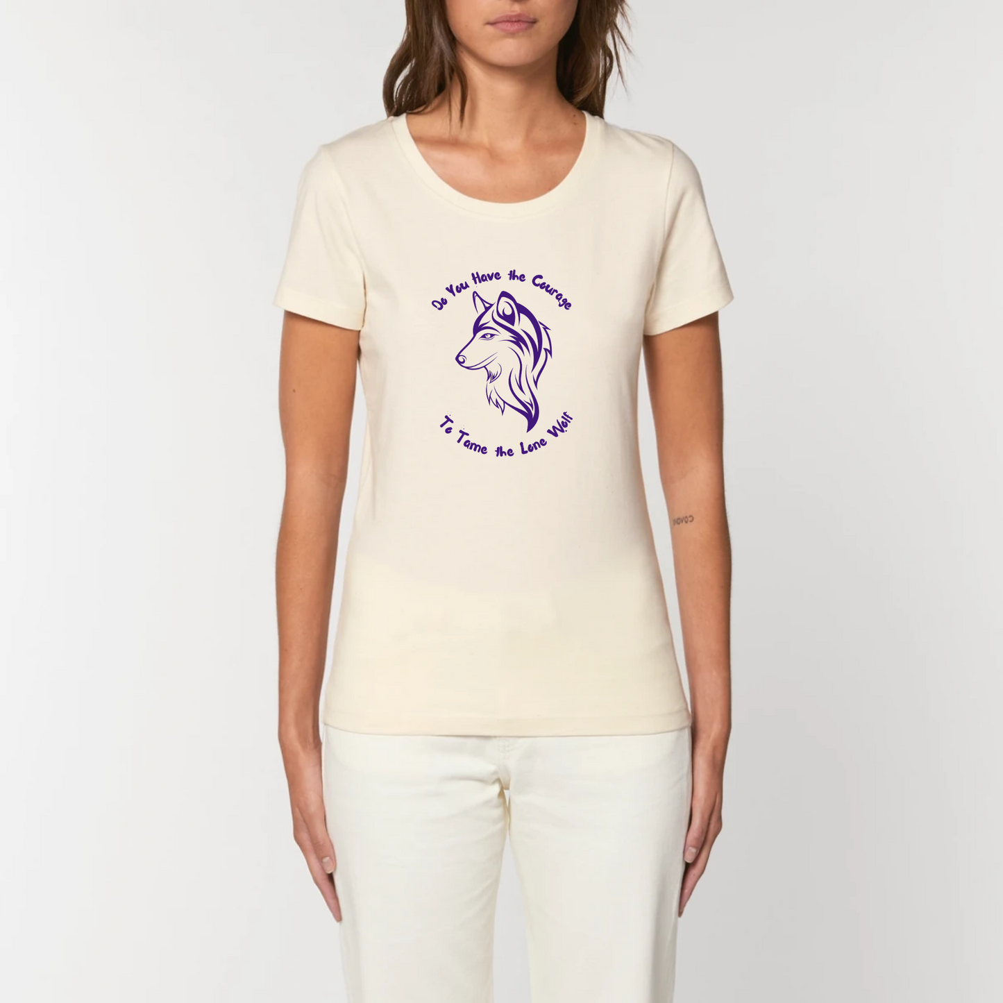 Graphic design t-shirt for women which features a feminine wolf head with wording above and below the wolf head saying Do You Have the Courage to Tame the Lone Wolf. The t-shirt is white