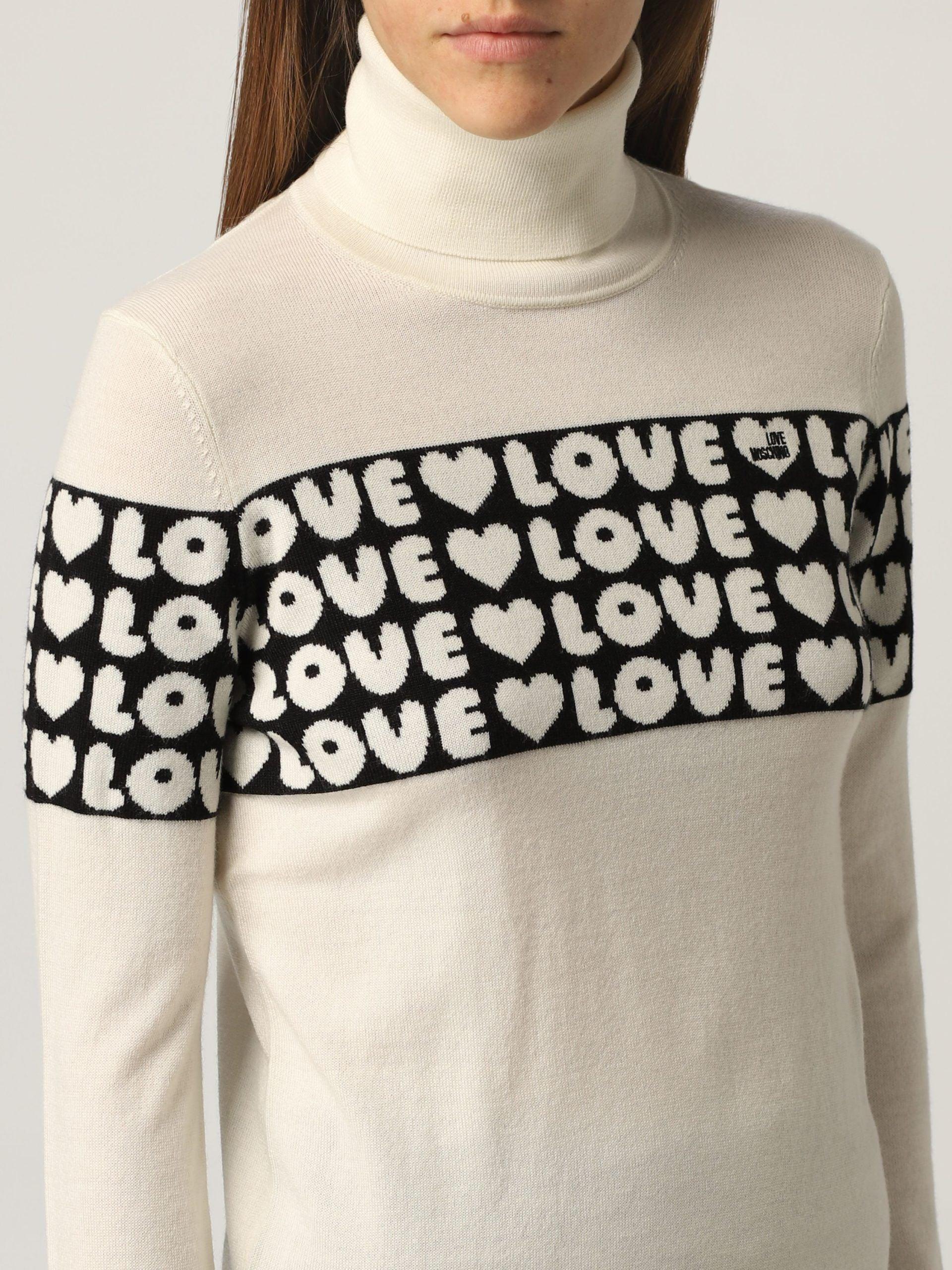 Love Moschino Women's White Acrylic Turtleneck Sweater designed by Love Moschino available from Moon Behind The Hill 's Clothing > Shirts & Tops > Womens range